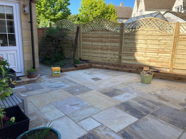 Sandstone patio installation in Layer-de-la-Haye