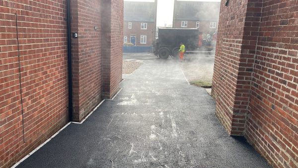 Tarmac with edging kerb border in Eight Ash Green